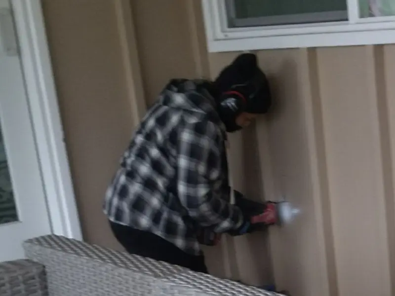 Professional electrician installing an exterior outlet in Ponderosa Park
