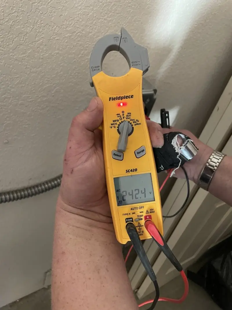 Voltage testing with clamp meter during Aluminum Wiring Replacement in Ponderosa Park